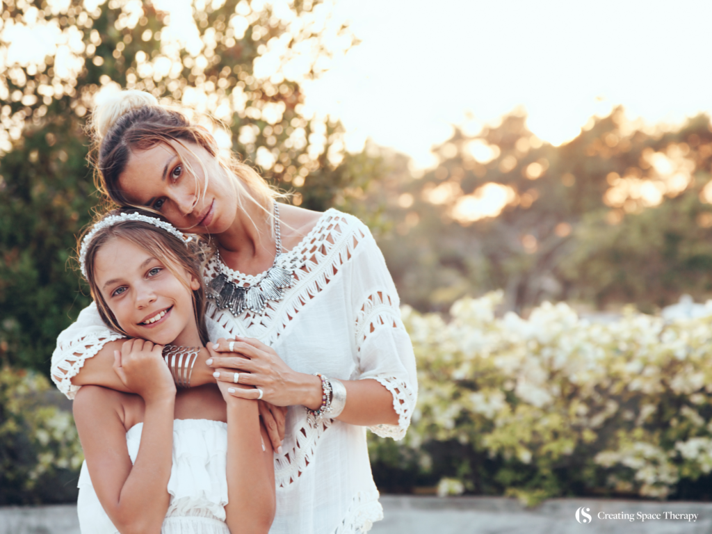 Mom with her young daughter who is not having a meltdown or temper tantrum.